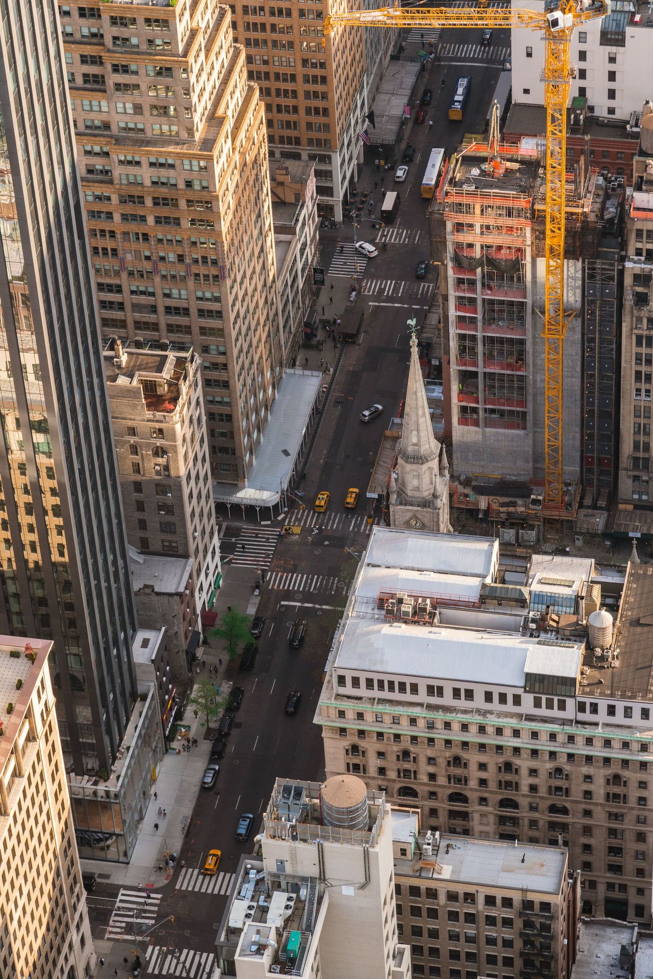 Aerial view of a street grid and building layout in a city.
