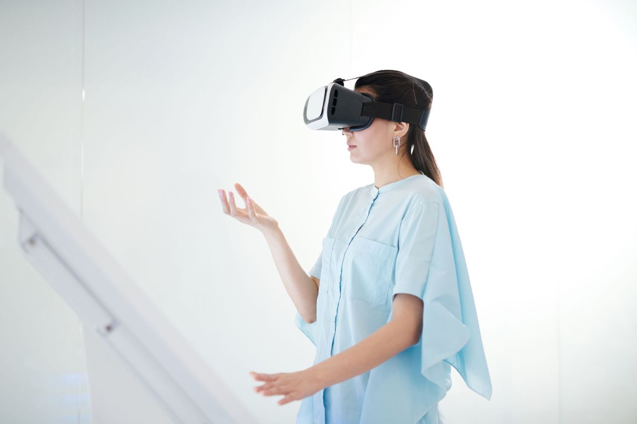 A person exploring virtual reality through a VR headset.