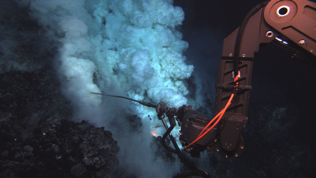 Sampling arm of the Jason underwater robot surveying a seafloor volcanic area.