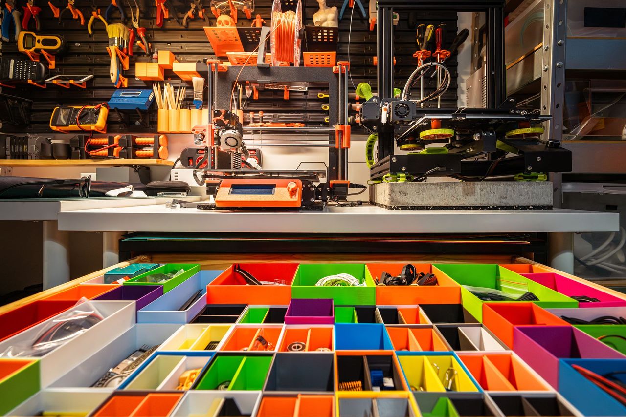 3D printers, tools and parts in a prototyping area.
